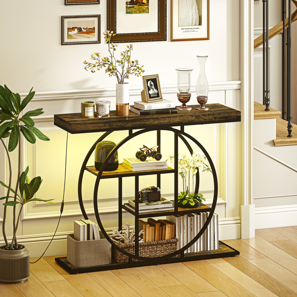 Industrial console table with circular metal frame, dark wood top, open shelves, warm LED glow.