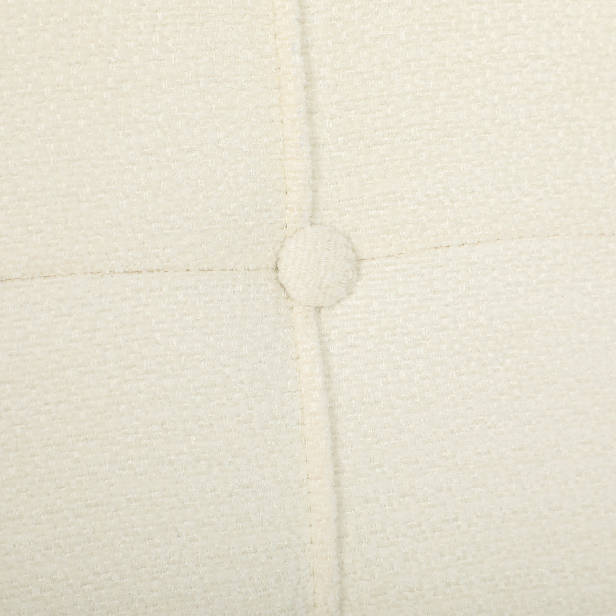 Cream chenille upholstery detail with tufted button seams on the lounge chair back.
