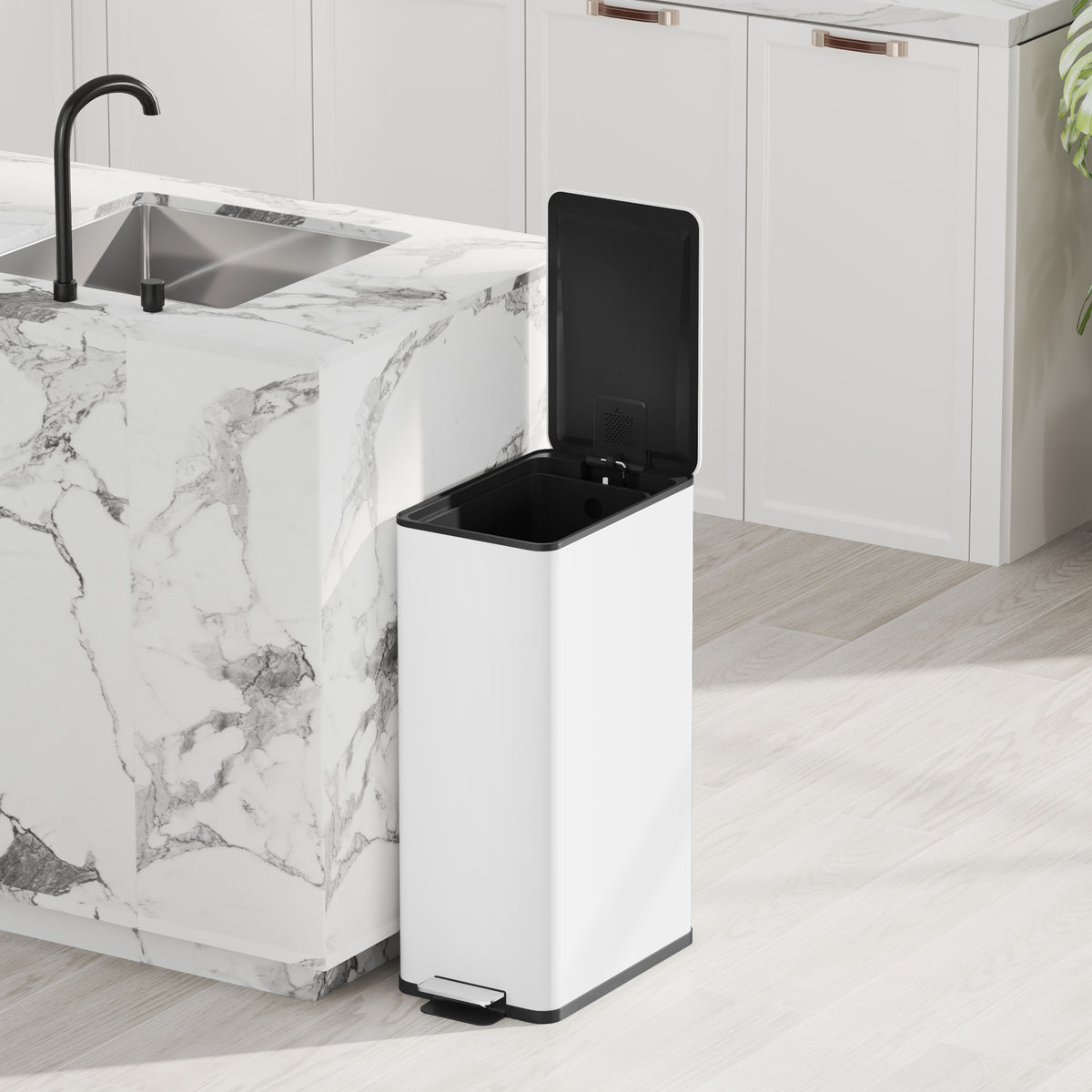 White pedal trash bin with black soft-close lid open near a kitchen sink
