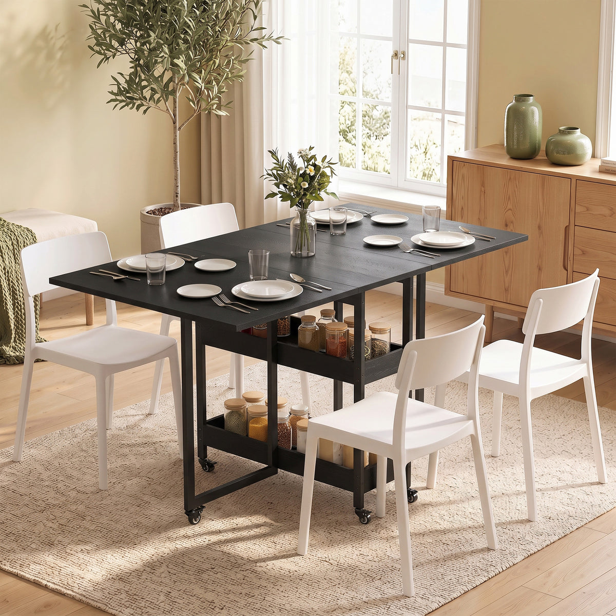 Black drop-leaf dining table with metal frame and open shelf storage
