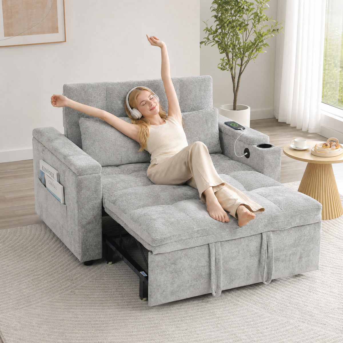 Grey 2-seater sofa bed with pull-out sleeper, armrest storage and hidden side table