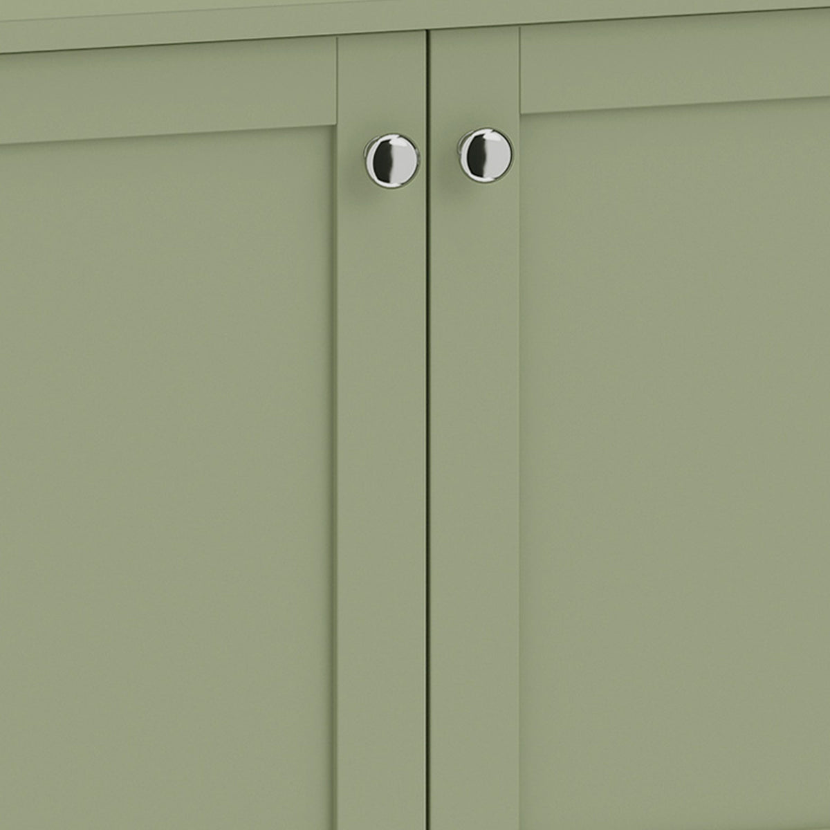 Close-up of green cabinet doors with two silver-tone knobs and vertical seams.