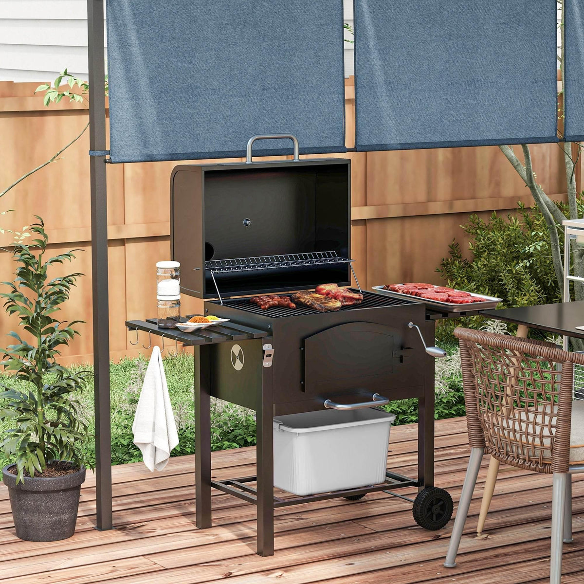 Charcoal barbecue grill smoker trolley with side shelves, thermometer, and storage bin