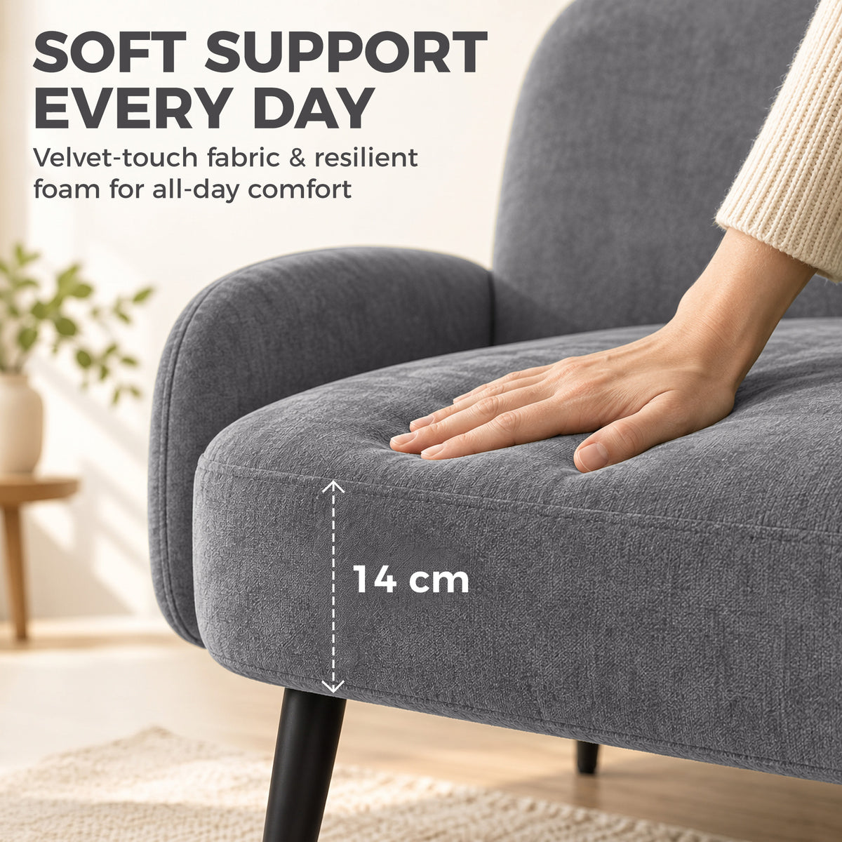 Close-up of light grey velvet-touch sofa armrest with stitched rounded cushion