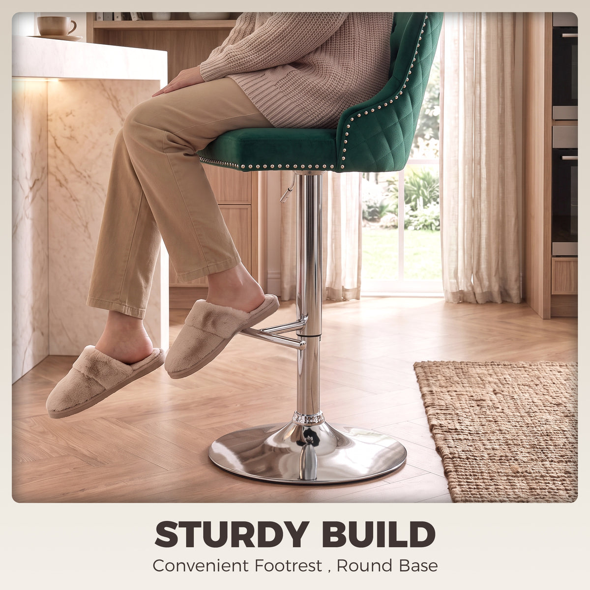 Green velvet swivel bar stool with quilted back, padded seat, and round chrome footrest base