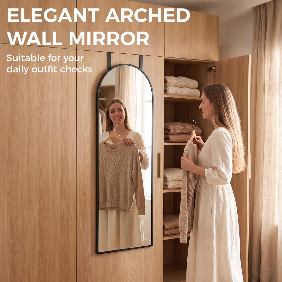 Arched wall mirror with black frame on a closet door for full-body checking